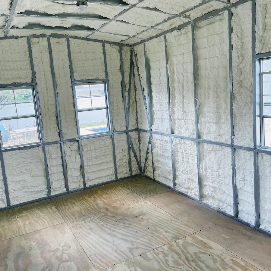 Closed-cell spray foam insulation applied to wall cavities in a residential project in Carnegie
